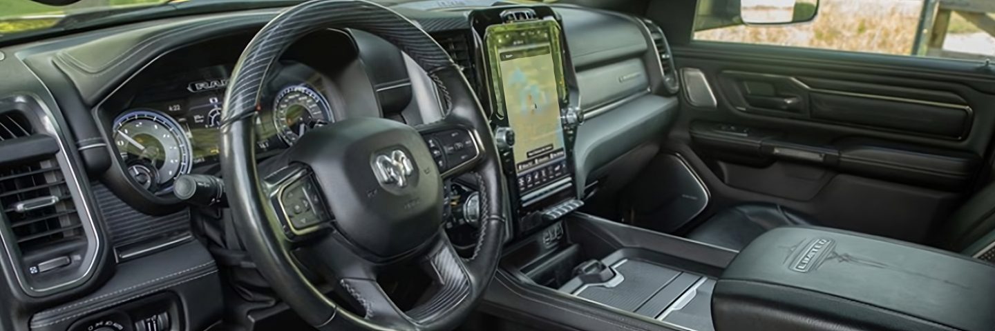 The interior of the 2023 Ram 1500 with the large Uconnect touchscreen displaying a navigation map.